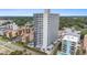 Exterior view of a high rise condo featuring balconies, street access, and palm trees at 5511 North Ocean Blvd. # 806, Myrtle Beach, SC 29577
