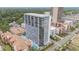 Exterior view of a high rise condo and a street with palm trees and a pool at 5511 North Ocean Blvd. # 806, Myrtle Beach, SC 29577