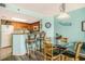 Dining and kitchen area with breakfast bar seating and full kitchen, perfect for casual dining at 5511 North Ocean Blvd. # 806, Myrtle Beach, SC 29577
