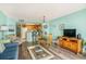 Open-concept living room with eat-in kitchen, dining area, entertainment center, and comfortable seating at 5511 North Ocean Blvd. # 806, Myrtle Beach, SC 29577