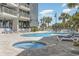 Inviting outdoor pool and hot tub area with lounge chairs, perfect for relaxation and recreation at 5511 North Ocean Blvd. # 806, Myrtle Beach, SC 29577