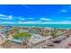 Expansive aerial view showcases resort pools, a waterpark, palm trees, the ocean, and convenient parking at 5905 S Kings Hwy. # 523 A, Myrtle Beach, SC 29575