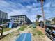 Attractive exterior view of a multi-story condo building with beach access and recreational area at 5905 S Kings Hwy. # 523 A, Myrtle Beach, SC 29575