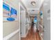 Inviting hallway with beach-themed decor leading to a bright living space with ocean view at 5905 S Kings Hwy. # 523 A, Myrtle Beach, SC 29575