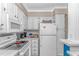 Efficient kitchen with white cabinets, appliances, and ample counter space at 5905 S Kings Hwy. # 523 A, Myrtle Beach, SC 29575