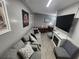 Cozy living room with a comfortable gray couch, decorative pillows, and a flatscreen television for relaxation at 5905 S Kings Hwy. # 523 A, Myrtle Beach, SC 29575