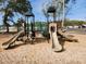 playground featuring multiple slides, climbing structures, and a sandy base for safe play at 5905 S Kings Hwy. # 523 A, Myrtle Beach, SC 29575