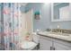 Bathroom featuring a shower with nautical curtain and granite counters at 6000 N Ocean Blvd. # 133, North Myrtle Beach, SC 29582