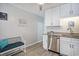 Bright kitchen features granite counters, stainless appliances, and white cabinets at 6000 N Ocean Blvd. # 133, North Myrtle Beach, SC 29582