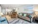 Inviting living area with a view into the kitchen, comfortable seating, and coastal-inspired decor at 6000 N Ocean Blvd. # 133, North Myrtle Beach, SC 29582