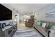 Cozy living room with kitchen and bedroom view, beachy decorations, and comfortable seating arrangements at 6000 N Ocean Blvd. # 133, North Myrtle Beach, SC 29582