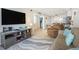 Open concept living area with kitchen view, flat screen tv, cozy seating, and beach-themed decorations at 6000 N Ocean Blvd. # 133, North Myrtle Beach, SC 29582