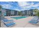 Inviting outdoor pool area with lounge chairs, perfect for relaxation and summer fun at 6000 N Ocean Blvd. # 133, North Myrtle Beach, SC 29582