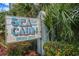 Charming 'Sea Cabin' sign surrounded by lush greenery, creating a coastal welcome at 6000 N Ocean Blvd. # 133, North Myrtle Beach, SC 29582