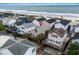 Charming coastal home with a large deck and palm trees, situated near a beautiful beach with ocean view at 6001 - B7 S Kings Hwy., Myrtle Beach, SC 29575