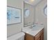 Bathroom featuring a sink and a mirror with a wooden cabinet at 6001 - B7 S Kings Hwy., Myrtle Beach, SC 29575