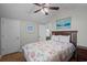 Bedroom featuring a ceiling fan, a bed, and a door at 6001 - B7 S Kings Hwy., Myrtle Beach, SC 29575
