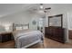 Bedroom featuring a ceiling fan, a dresser, and a window at 6001 - B7 S Kings Hwy., Myrtle Beach, SC 29575