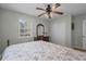 Bedroom with ceiling fan, window view, and coordinating dresser with ample storage at 6001 - B7 S Kings Hwy., Myrtle Beach, SC 29575