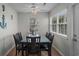 Bright dining room with large windows, featuring a stylish table with six chairs and coastal decor at 6001 - B7 S Kings Hwy., Myrtle Beach, SC 29575