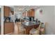 Galley kitchen with wood cabinets, stainless sink, and adjacent dining area at 6001 - B7 S Kings Hwy., Myrtle Beach, SC 29575