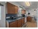 Efficient kitchen space with wooden cabinets, light countertops, and modern appliances at 6001 - B7 S Kings Hwy., Myrtle Beach, SC 29575