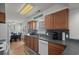 Traditional kitchen with wood cabinetry, tile backsplash, and dining area at 6001 - B7 S Kings Hwy., Myrtle Beach, SC 29575