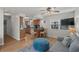 Open living space with hardwood floors, kitchen bar, and modern furnishings at 6001 - B7 S Kings Hwy., Myrtle Beach, SC 29575