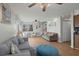 Bright living room with light wood floors, comfortable seating, and view to the staircase at 6001 - B7 S Kings Hwy., Myrtle Beach, SC 29575