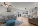 Bright living room with light wood floors, comfortable seating, and sliding glass doors to the patio at 6001 - B7 S Kings Hwy., Myrtle Beach, SC 29575