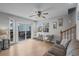 Cozy living room with access to an outdoor patio, features a staircase to the second floor at 6001 - B7 S Kings Hwy., Myrtle Beach, SC 29575