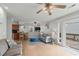 Comfortable living area with a view of the outdoor deck through sliding glass doors, and adjacent kitchen at 6001 - B7 S Kings Hwy., Myrtle Beach, SC 29575