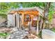 Charming wooden bar with TV, counter seating, outdoor patio, and grill at 6001-N73 South Kings Hwy., Myrtle Beach, SC 29575