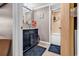 Spacious bathroom featuring tiled shower/tub, blue rugs, and a vanity with marble counters at 6001-N73 South Kings Hwy., Myrtle Beach, SC 29575