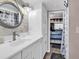 Bright bathroom features white vanity, decorative mirror, and nautical decor at 6001-N73 South Kings Hwy., Myrtle Beach, SC 29575