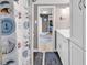 Bright bathroom leading to a bedroom, complete with a seashell-themed shower curtain at 6001-N73 South Kings Hwy., Myrtle Beach, SC 29575
