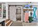 Open bedroom view featuring a decorative barn door at 6001-N73 South Kings Hwy., Myrtle Beach, SC 29575