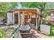 Cozy outdoor space featuring a cabana with bar seating, a grill, a deck, and outdoor furniture at 6001-N73 South Kings Hwy., Myrtle Beach, SC 29575