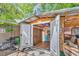 Exterior of an outbuilding with a double door entry, exterior lights, and unique nautical themes at 6001-N73 South Kings Hwy., Myrtle Beach, SC 29575