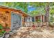 Exterior view of two wooden outbuildings, with one featuring a deck with nautical accents at 6001-N73 South Kings Hwy., Myrtle Beach, SC 29575