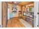 Interior view of outbuilding with wood paneling and floors, TV, mini fridge and serving area at 6001-N73 South Kings Hwy., Myrtle Beach, SC 29575