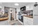 Bright kitchen features white cabinets, wood countertop, and black microwave at 6001-N73 South Kings Hwy., Myrtle Beach, SC 29575