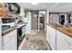 Charming kitchen featuring wood countertops, white cabinets, and modern appliances at 6001-N73 South Kings Hwy., Myrtle Beach, SC 29575