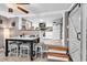 Bright kitchen with a step up, white cabinetry, and modern appliances at 6001-N73 South Kings Hwy., Myrtle Beach, SC 29575