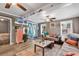 Bright living room with modern decor, cozy seating, and access to outdoor views at 6001-N73 South Kings Hwy., Myrtle Beach, SC 29575