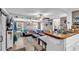 Spacious living room with neutral colors, fan, and eat-in area at 6001-N73 South Kings Hwy., Myrtle Beach, SC 29575