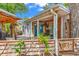 Charming patio with outdoor seating, a wooden fence, and lush greenery at 6001-N73 South Kings Hwy., Myrtle Beach, SC 29575