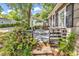 Exterior view of cottage showing the outdoor seating area and surrounding yard at 6001-N74 South Kings Hwy., Myrtle Beach, SC 29575