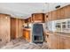 Comfortable living space with wood paneling, a fireplace, and a window view, offering a warm atmosphere at 6001-N74 South Kings Hwy., Myrtle Beach, SC 29575