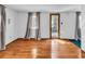 Bright, empty living room with hardwood floors, white walls, and natural light at 6001-N74 South Kings Hwy., Myrtle Beach, SC 29575